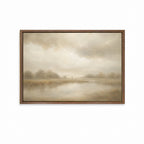 A framed landscape painting featuring Jesus with his lamb with soft beige and brown tones under a cloudy sky, set in a dark brown wooden frame. Good Shepherd Christian wall art inspired by Psalm 23 showing a shepherd leading sheep beside still waters