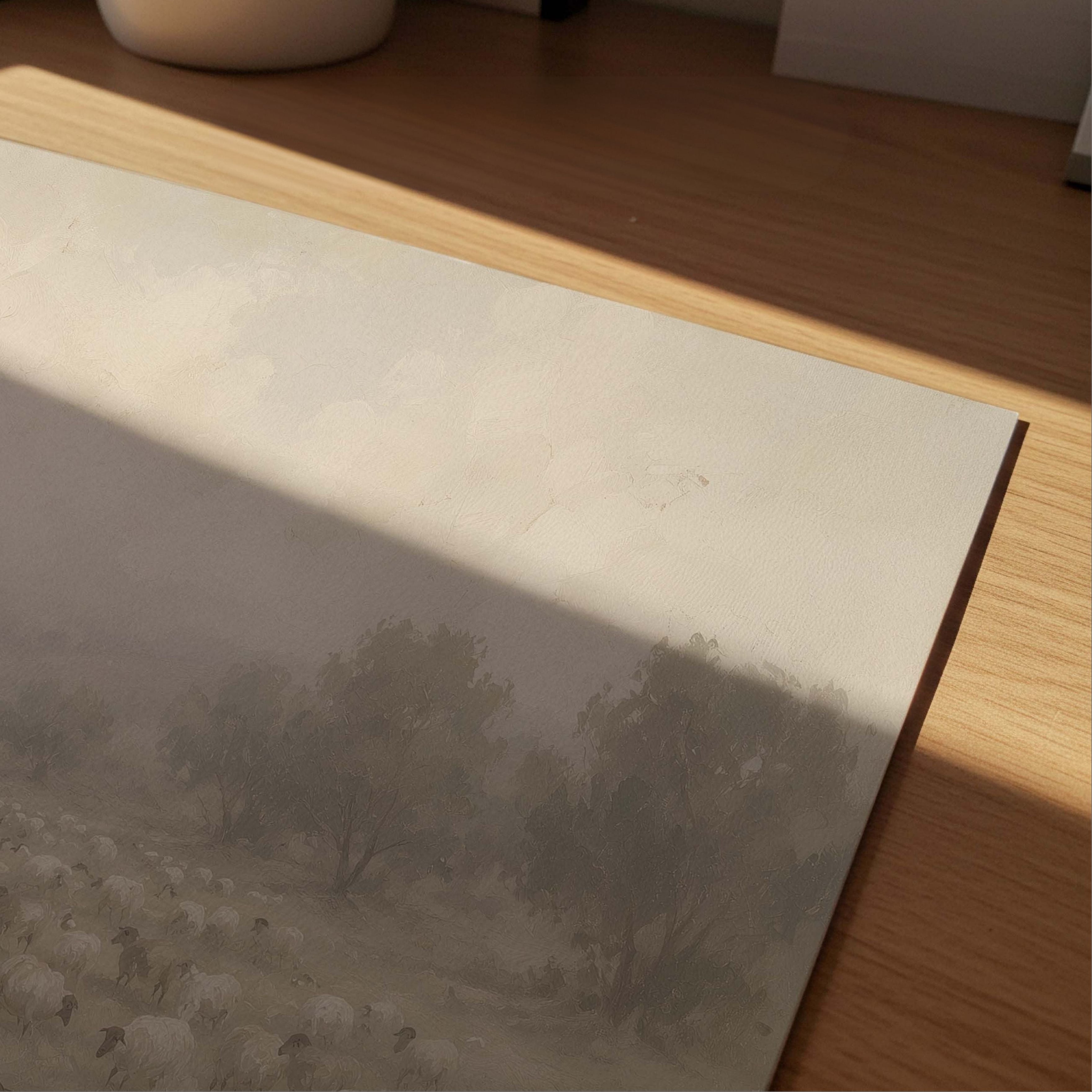 Jesus as the Good Shepherd walking among a flock of sheep in a peaceful landscape, shown in a soft neutral Christian art print, close up